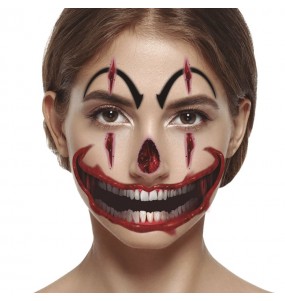 Tatuaggio del volto di un clown assassino per completare il costume di paura
